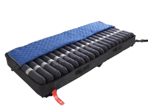 Mattress with cover rolled back to show air cell bladders