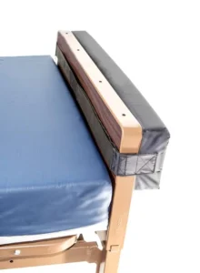 Wall guard strapped onto footboard