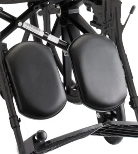 Elevating footrests with flip up footplates and vinyl padded calf pads